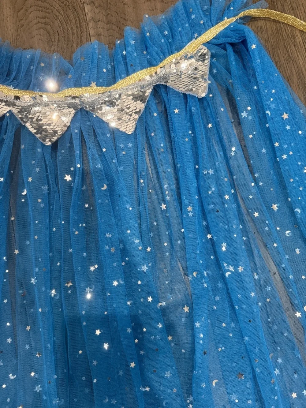Blue Star and moon sparkle Tulle cape with silver sequence trim and a gold tie
